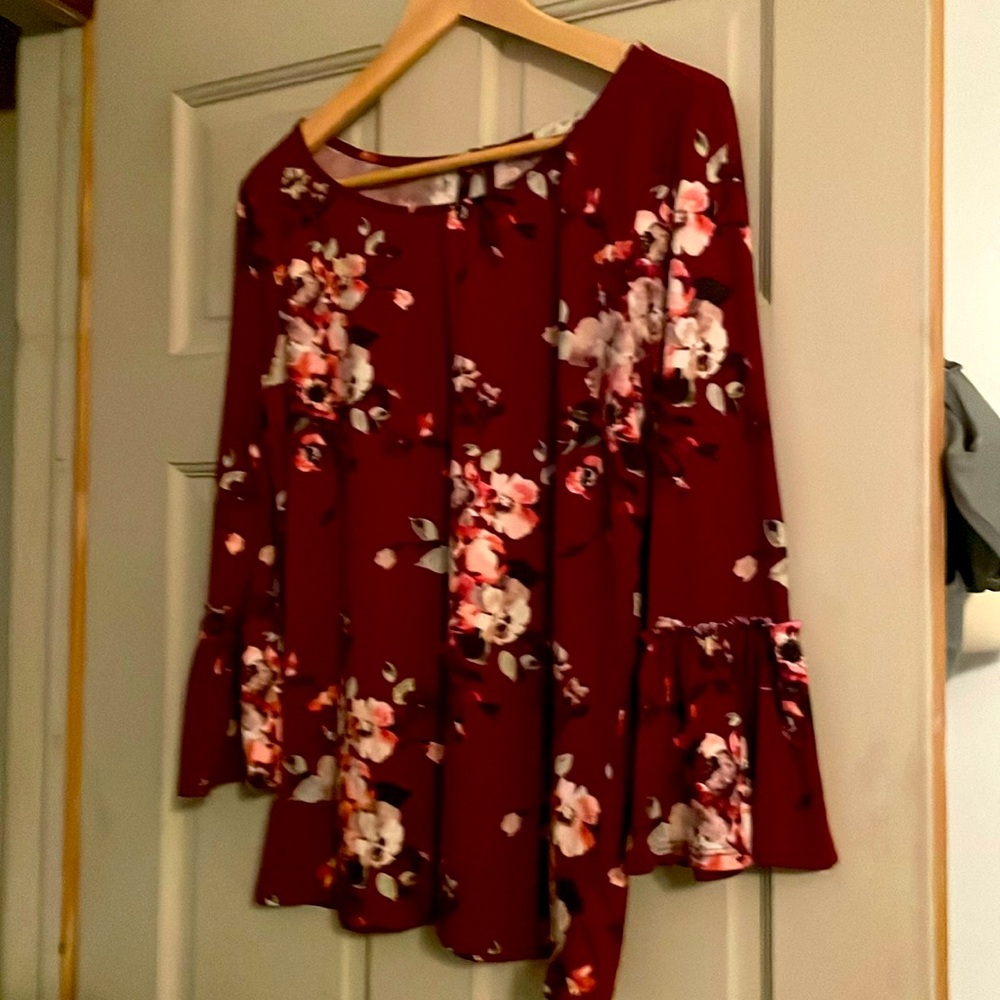 Floral top. Deep burgundy in color with colorful flowers.